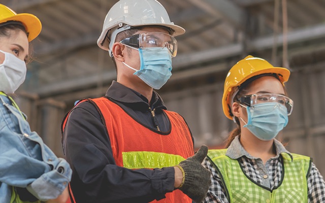 3 workers with PPE and face masks