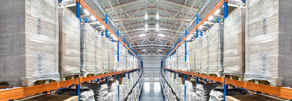 Huge distribution warehouse with high shelves.